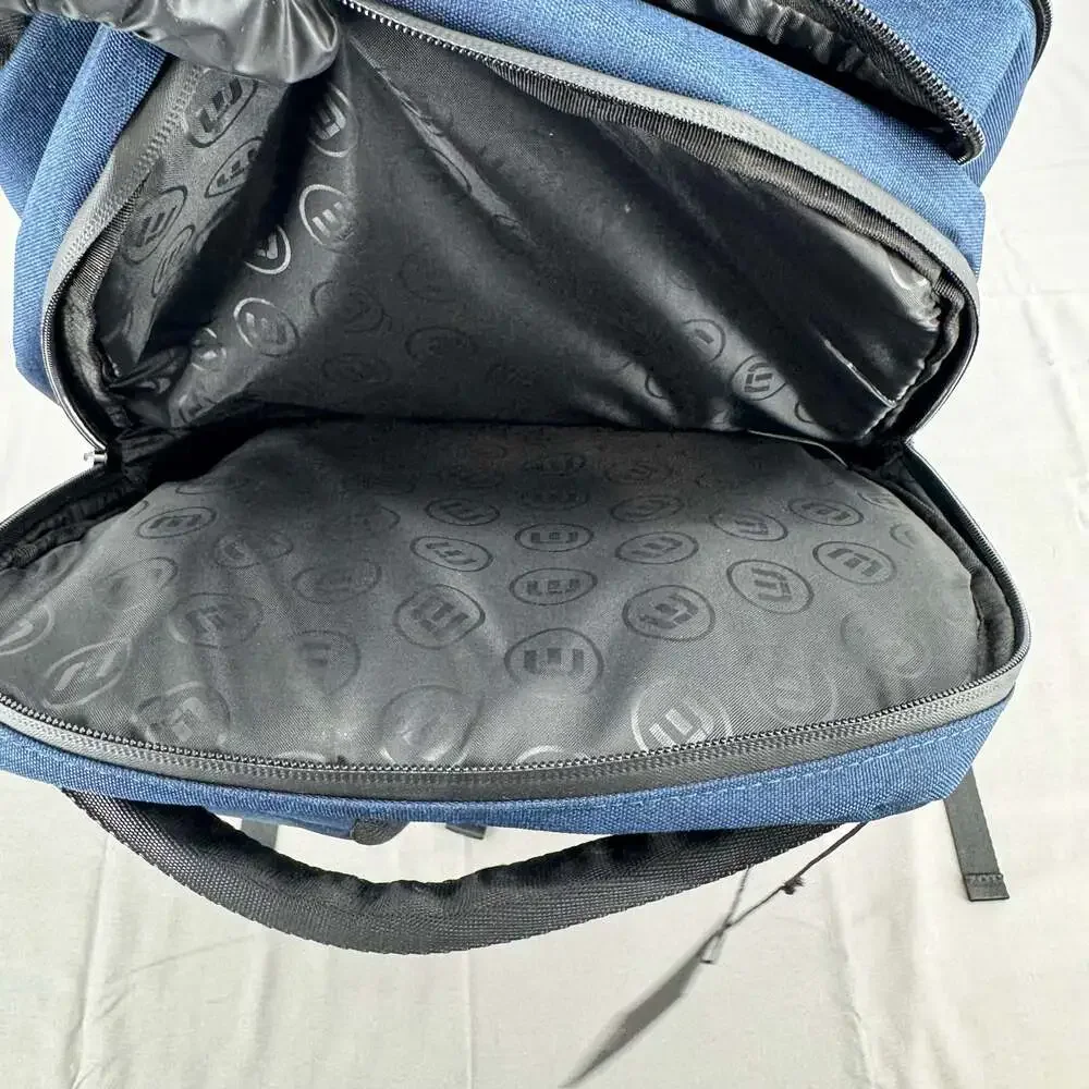 TravisMathew Duration Backpack in Navy with FanDuel Racing Logo